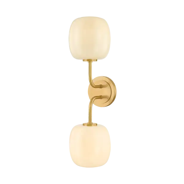 The Lisette vanity light brings sophisticated geometric design with botanical influences to bathroom spaces. Featuring shiny cream opal glass shades with delicate fluted edges and an Aged Brass finish, it delivers both functional illumination and decorative appeal.