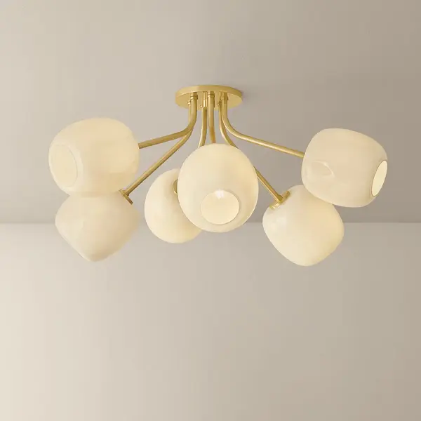 The Lisette Semi Flush transforms geometric simplicity into expressive art with its staggered 6-light arrangement. Shiny cream opal glass shades with delicate fluted edges create a bouquet-like composition, while Aged Brass finish adds warmth and sophistication to any interior. - alternate view