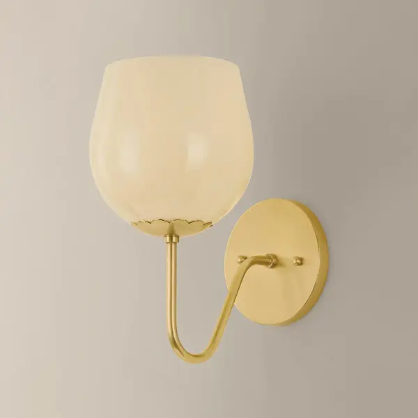 The Genevieve Wall Sconce brings vintage Italian charm with its botanical-inspired design. Unfurling arms support rosebud-shaped Cream Opal glass shades, while scalloped fitter details and Aged Brass finish add refined sophistication. - alternate view