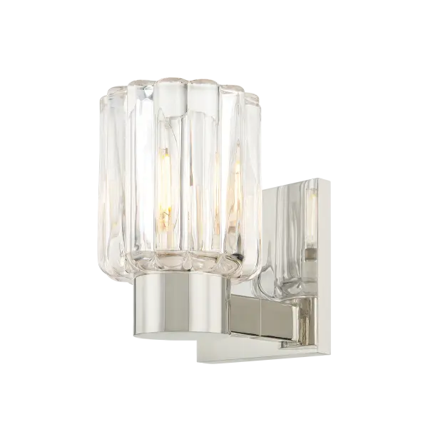 The Danae Bath Sconce combines clean metalwork with distinctive fluted glass that beautifully diffuses light. Its petite size and sophisticated design make it perfect for powder rooms and bathrooms seeking fresh, functional elegance.