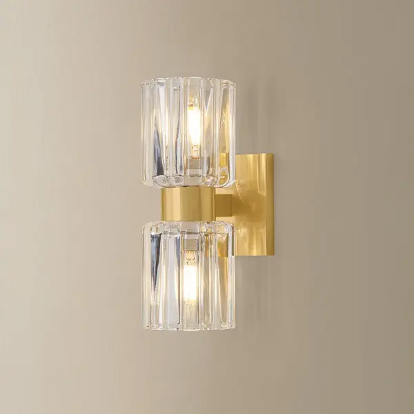 The Danae Bath Sconce brings sophisticated European design to your bathroom with its distinctive fluted glass shade inspired by Orrefors vases. The scalloped glass beautifully diffuses light while the clean metalwork adds refined elegance. - alternate view
