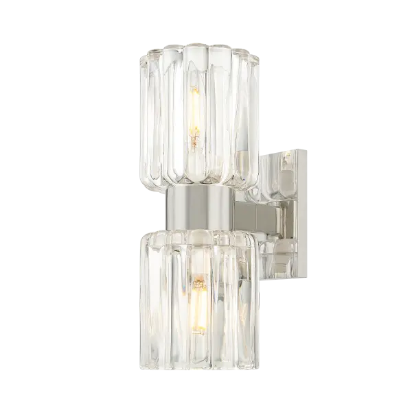 The Danae Bath Sconce combines clean metalwork with distinctive fluted glass that beautifully diffuses light. Its petite profile and scalloped shade make it ideal for powder rooms and baths where refined style meets function.