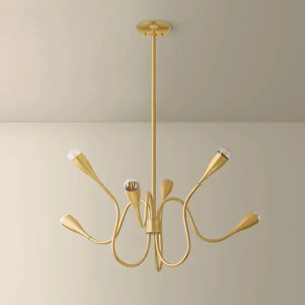 The Anaise chandelier captures Stilnovo-inspired mid-century design with graceful two-tier arms that extend expressively through space. Flared socket cups hold exposed bulbs like flower buds, creating kinetic energy in Aged Brass finish. - alternate view