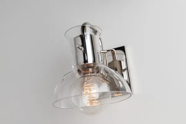The Riley vanity light combines classic elegance with contemporary simplicity, featuring a polished nickel finish that complements a wide range of bathroom styles. Perfect for modern and traditional bathrooms alike. - alternate view