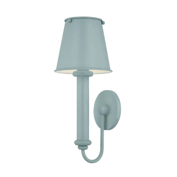 The Yara sconce combines elevated design with playful character, featuring a substantial candle sleeve, soft decorative accents, and a matching metal shade. Available in Dusk Blue, it brings color and personality to any space.