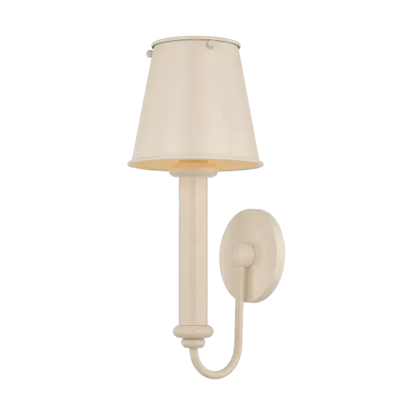 The Yara sconce combines elevated design with playful personality through its substantial candle sleeve, soft accent details, and matching metal shade. Available in Soft Bisque, it brings color and character to any space.