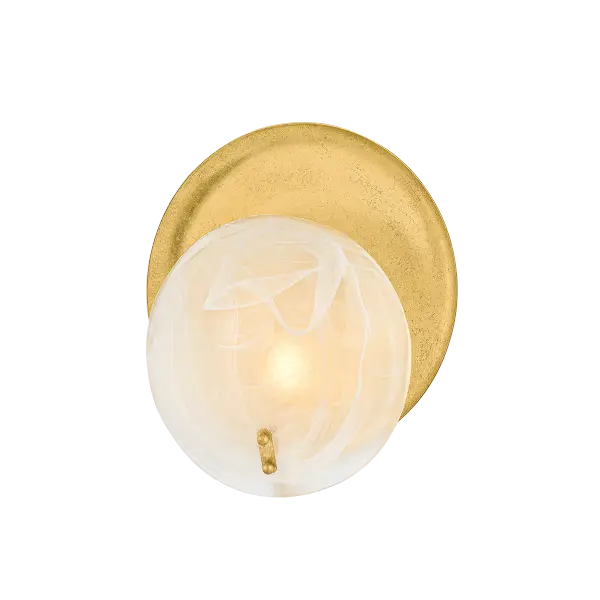 The Shanette Wall Sconce combines artistry with functionality through its distinctive Piastra glass shade featuring soft white swirls. The Vintage Gold Leaf finish and metal reflector create depth and warmth, making it a sophisticated choice for any interior.
