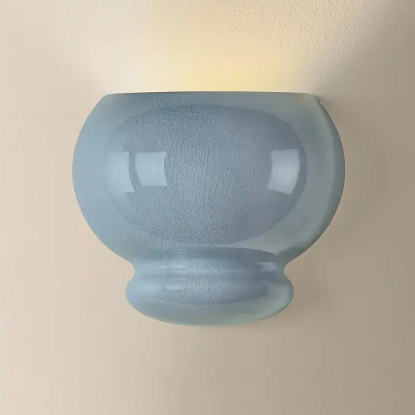 An exploration of voluminous forms and soft, endearing colors, the Pia family leans into the playful side of lighting. Stout proportions, generous curves, and stacked ceramic disc shapes lend an artisanal feel that is enhanced by the Butter Crackle and Chateau Crackle finishes. The table lamp is topped with a classic white linen drum shade, while the pendant, flush mount, and wall sconce cast light through a large oculus. Finished with Aged Brass hardware, this family adds artistic visual interest to any space. Part of our Hilary Matt x Mitzi Tastemakers collection. - alternate view