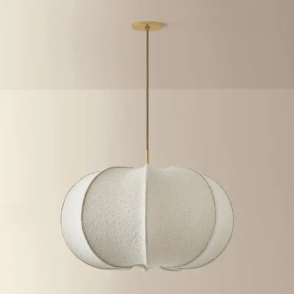 A feminine take on a voluminous, balloon-shade silhouette, the Alexandra family brings an extra dose of cozy comfort to contemporary interiors. As a pendant in two sizes and a floor lamp, it exemplifies designer Hilary Matt's philosophy of elevating simple forms with distinctive materials. Constructed of stretched ivory boucle fabric, the faceted shades nod to mid-century minimalism with a tactile upgrade. Sleek Aged Brass stems complete each playful, yet sophisticated piece. Part of our Hilary Matt x Mitzi Tastemakers collection. Collection: Alexandra Designer: Hilary Matt Finish: Aged Brass Glass: Textured Linen Width: 30.00" Height: 20.00" Weight: 7.50 lb Wire: 120" Jute Canopy: 5.50"x0.50" Number of Bulbs: 1 Maximum Wattage: 25.00 W Bulb Type: A21 Bulb Base: E26 Medium Voltage: 120.00 V Material: Textile Country of Origin: VN Safety Listing: UL/cUL Safety Rating: Damp Manufacturer Warranty: 1 Year Limited Manufacturer Spec Sheet Instructions - alternate view