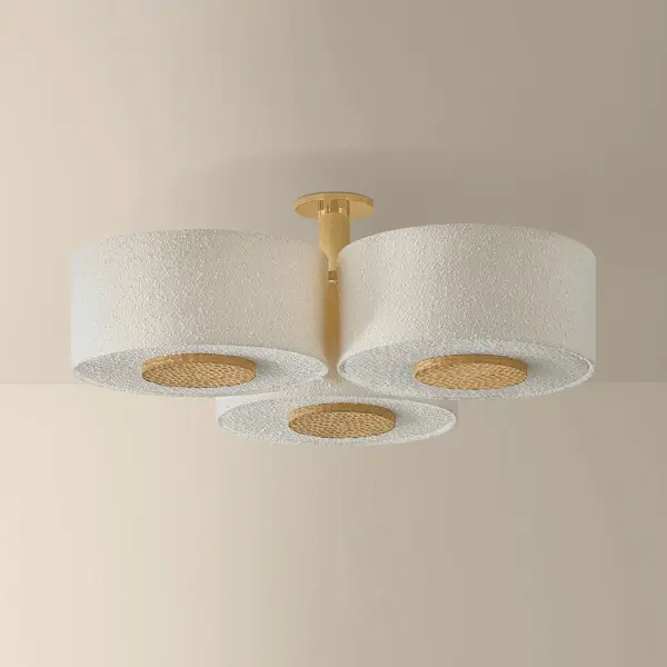 Leaning into cozy minimalism, the Miller family pairs warm neutrals with high textural contrasts. Accented by chiseled light beechwood and Aged Brass elements, the large ivory boucle drum shades create a soft, voluminous statement overhead. Depending on the ceiling height, Miller is available as a flush mount, semi-flush mount, or pendant, bringing a sense of artful ease to living and dining spaces. Part of our Hilary Matt x Mitzi Tastemakers collection. Due to the one-of-a-kind nature of the medium, exact colors and patterns may vary slightly from the image shown. Collection: Miller Designer: Hilary Matt Finish: Aged Brass Glass: Textured Linen Width: 40.00" Height: 14.00" Weight: 20.72 lb Canopy: 6.00"x0.50" Number of Bulbs: 9 Maximum Wattage: 15.00 W Bulb Type: A19 Bulb Base: E26 Medium Voltage: 120.00 V Material: Textile Country of Origin: VN Safety Listing: UL/cUL Safety Rating: Damp Manufacturer Warranty: 1 Year Limited Manufacturer Spec Sheet Instructions - alternate view