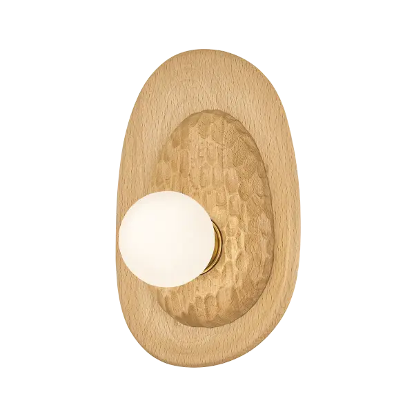 Defined by its sculptural, oblong silhouette and layered construction, the Pres wall sconce brings a sense of heritage craftsmanship to a compact space. The chiseled wood detailing juxtaposes the smooth beech wood reflector dish, creating an intriguing sense of depth. An exposed bulb draws attention to the natural grain and artisanal texture of the wood, while an Aged Brass cuff lends a subtle note of shine to the sconce’s profile. Part of our Hilary Matt x Mitzi Tastemakers collection. *Due to the one-of-a-kind nature of the medium, exact colors and patterns may vary slightly from the image shown.