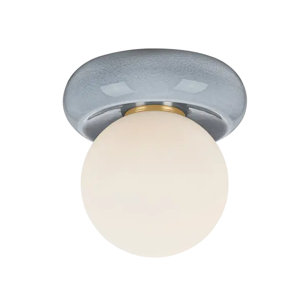The Tyra combines contemporary design with artisanal craftsmanship. Its compact 8.75-inch diameter makes it ideal for smaller spaces, while the unique crackle-glazed ceramic cap adds sculptural interest to any room.