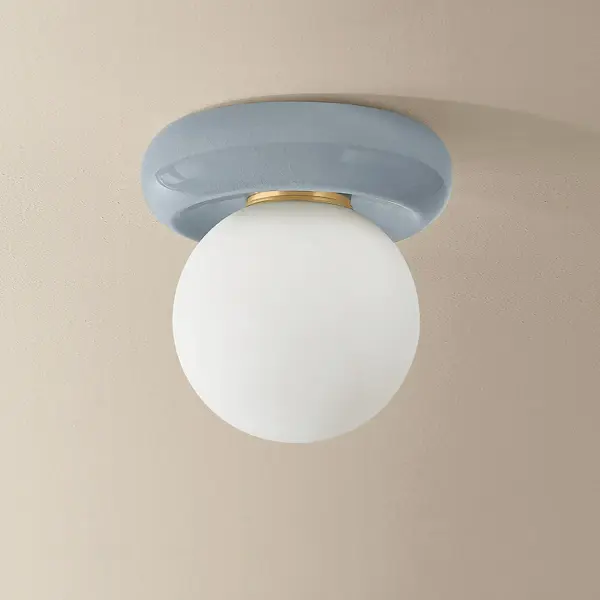 The Tyra combines contemporary design with artisanal craftsmanship. Its compact 8.75-inch diameter makes it ideal for smaller spaces, while the unique crackle-glazed ceramic cap adds sculptural interest to any room. - alternate view