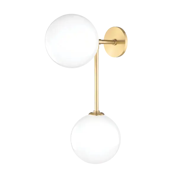The Ashleigh Wall Sconce brings timeless mid-century design to contemporary spaces with its clean lines and distinctive etched glass globes. The aged brass finish adds warmth while the glossy shades provide beautiful diffused lighting.