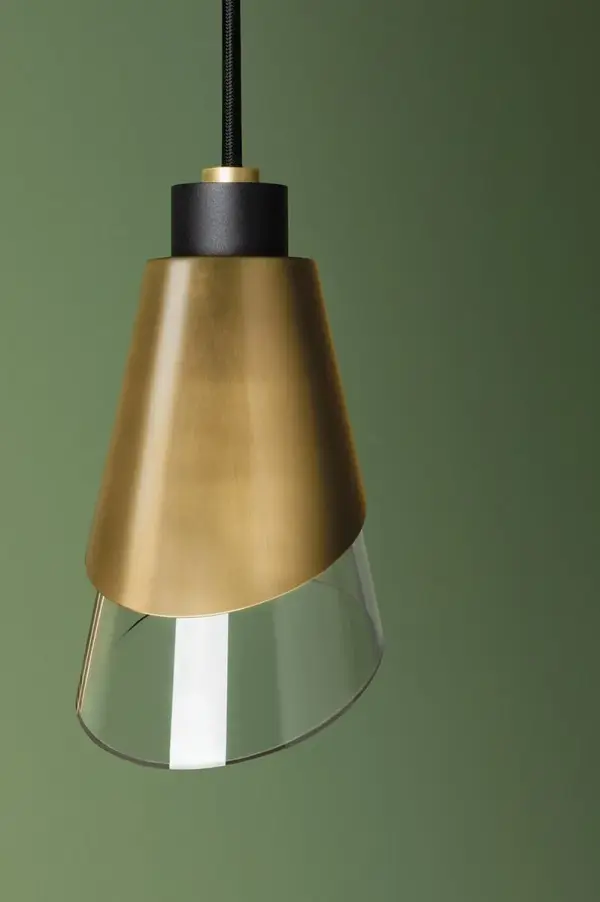The Angie Pendant brings high-fashion drama to your space with its distinctive metal-wrapped asymmetrical glass shade and cinched waist detail. Versatile finish options allow it to adapt from warm traditional to cool contemporary settings. - alternate view