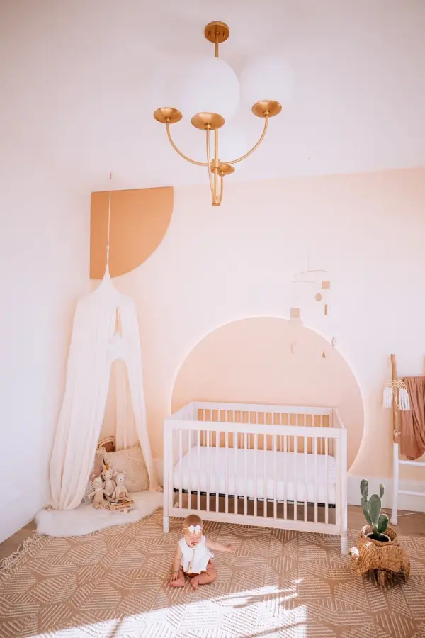 The Carrie Chandelier combines classic elegance with contemporary sensibility. Its gold finish and glass globe shades create a sophisticated focal point perfect for dining rooms and entryways. - alternate view