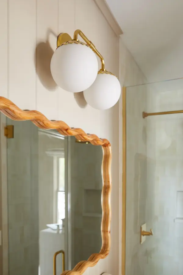 The Paige Bath and Vanity Light combines classic elegance with contemporary sensibility. Its gold finish and clean lines make it versatile for traditional and modern bathrooms alike, providing quality illumination. - alternate view