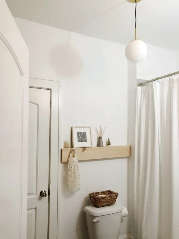 The Paige Pendant combines classic elegance with contemporary simplicity, featuring a refined gold finish that adds warmth to any space. Its versatile design works beautifully over kitchen islands or dining areas. - alternate view