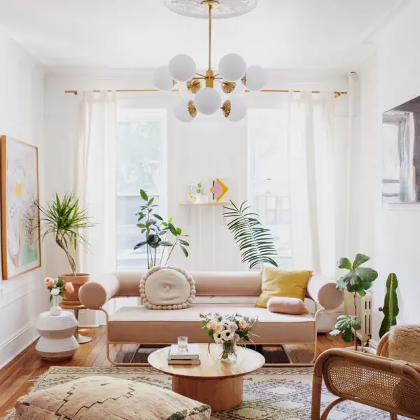 The Paige Chandelier combines classic elegance with contemporary sensibility, featuring an aged gold brass finish and glass globe shades. Perfect for creating a sophisticated focal point in dining rooms and entryways. - alternate view
