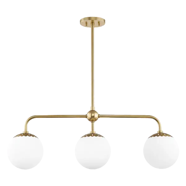 The Paige Linear Chandelier combines contemporary design with warm aged brass tones, creating a sophisticated focal point. Its linear form makes it perfect for dining tables and kitchen islands, while glass globes provide soft, ambient lighting.