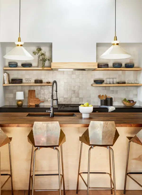 The Kiki Pendant combines contemporary sophistication with timeless elegance through its aged brass metalwork and crystal accents. Perfect for adding refined ambiance to dining spaces and entryways. - alternate view