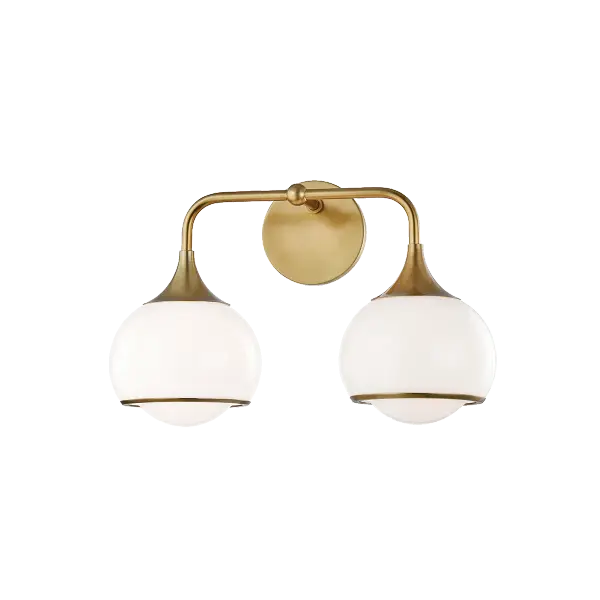 The Reese Bath and Vanity Light combines classic elegance with contemporary sensibility. Its aged gold brass finish and glass globes create a sophisticated focal point perfect for modern bathrooms and powder rooms.