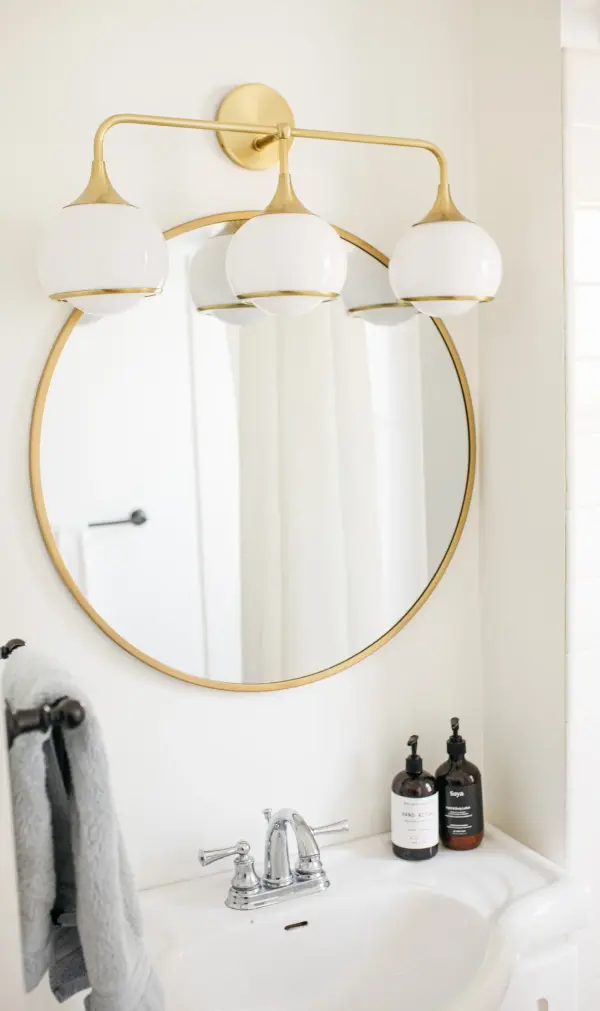 The Reese Bath and Vanity Light combines classic styling with contemporary sensibility. Its aged brass finish and clean lines make it versatile for traditional and modern bathrooms alike, delivering warm, flattering illumination. - alternate view
