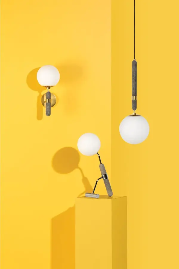 The Brielle Pendant combines classic elegance with contemporary sensibility. Its aged brass finish and glass globe shade create warm, inviting illumination perfect for dining areas and kitchen islands. - alternate view