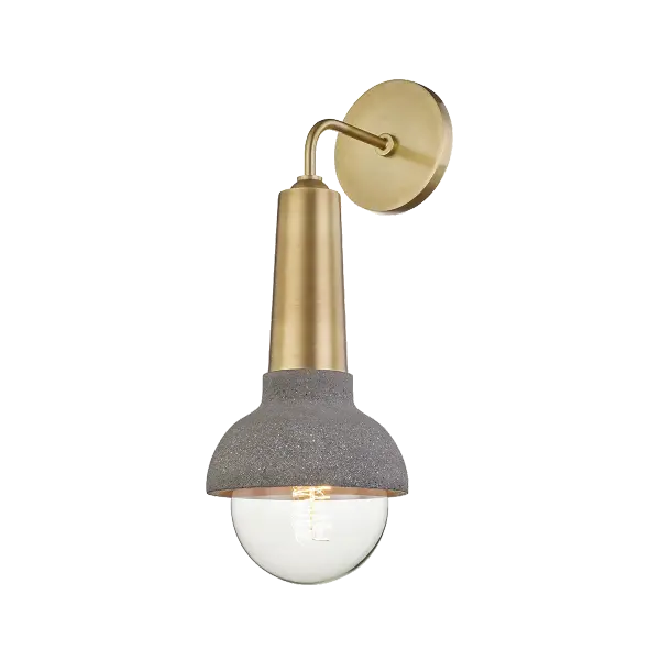 The Macy Wall Sconce offers versatile transitional styling with a warm gold finish, perfect for adding ambient lighting to bathrooms, hallways, and bedrooms. Its compact design fits various spaces.