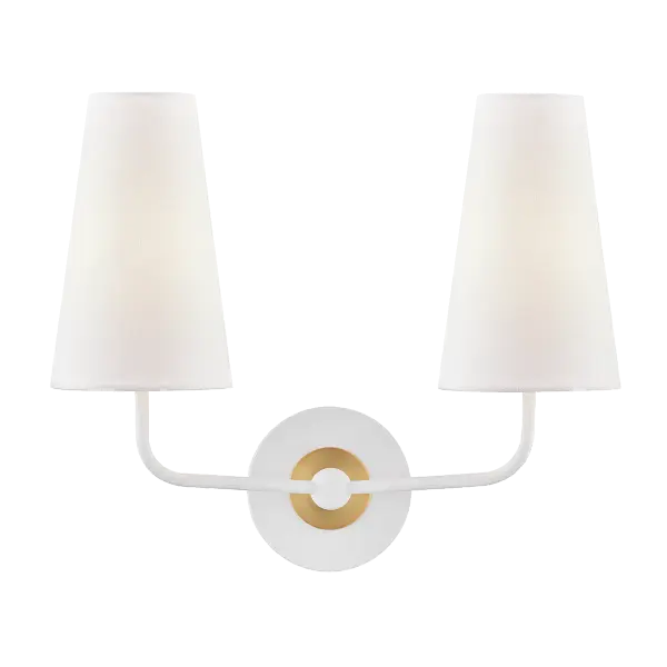 The Merri Wall Sconce combines classic aged brass metalwork with clean white glass for a versatile lighting solution. Its transitional design bridges traditional and contemporary aesthetics, making it ideal for bathrooms, hallways, and bedrooms.