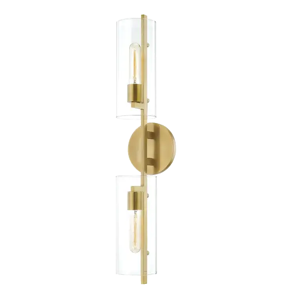 The Ariel Wall Sconce combines classic elegance with contemporary sensibility, featuring an aged gold brass finish and glass globe shade. Perfect for adding sophisticated ambient lighting to bathrooms, hallways, and bedrooms.