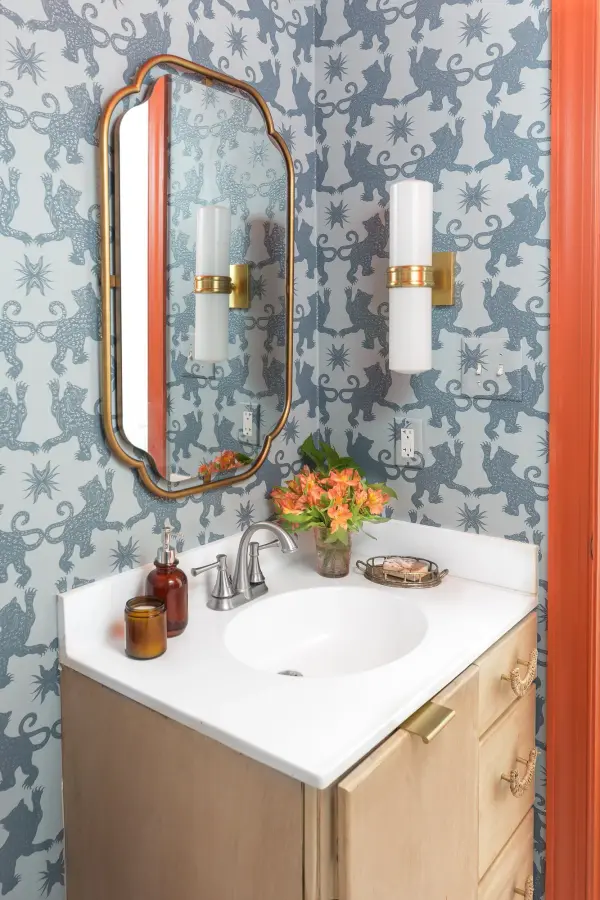 The Natalie Wall Sconce brings tried-and-true elegance to bathroom and bedroom spaces. Its classic globe design and aged brass finish make it perfect for vanity lighting while adding sophisticated style to any wall. - alternate view