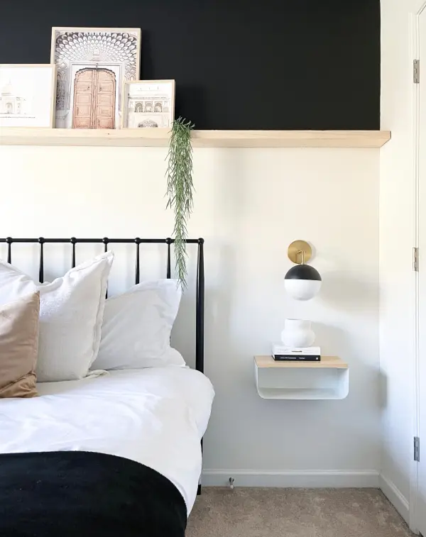 The Renee Wall Sconce combines classic elegance with contemporary simplicity. Its aged gold brass finish paired with black accents creates a sophisticated look perfect for modern bathrooms and hallways. - alternate view