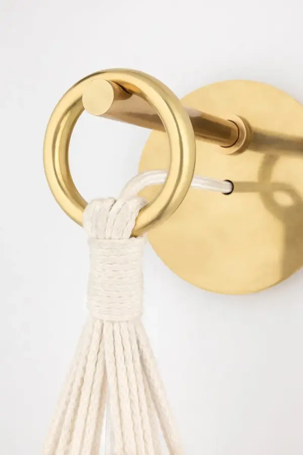 The Tessa Wall Sconce combines classic elegance with contemporary simplicity. Its gold finish and glass globe shade create warm, inviting illumination perfect for bathrooms, hallways, and bedrooms. - alternate view