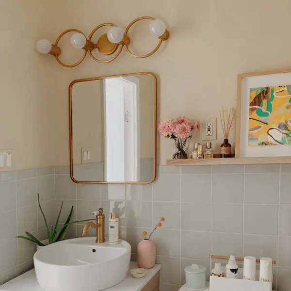 The Hope Bath and Vanity Light combines clean lines with classic glass globe shades, offering versatile illumination for contemporary and transitional bathrooms. Its wall-mounted design provides functional task lighting. - alternate view