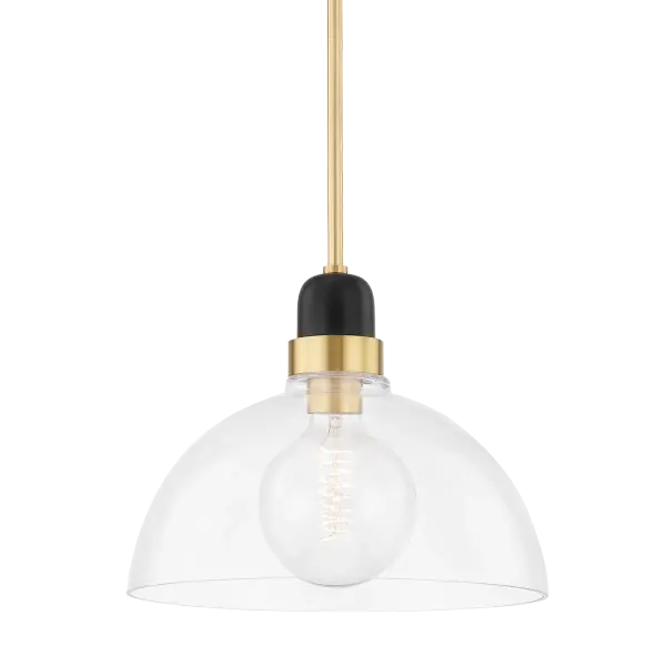The Camile Pendant reimagines the classic bistro light with contemporary industrial flair. Its open, exaggerated shade features hand-blown glass that allows light to flow freely, while the two-tone aged brass and black finish adds sophisticated contrast.
