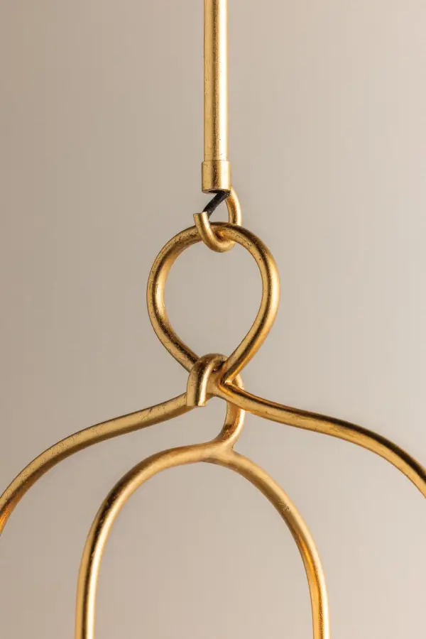 The Mallory Linear brings sophisticated style with its distinctive arched metal frame and gold leaf finish. Clear round bulbs on sleek candle holders create striking visual contrast, while the hanging loop adds graceful movement. - alternate view