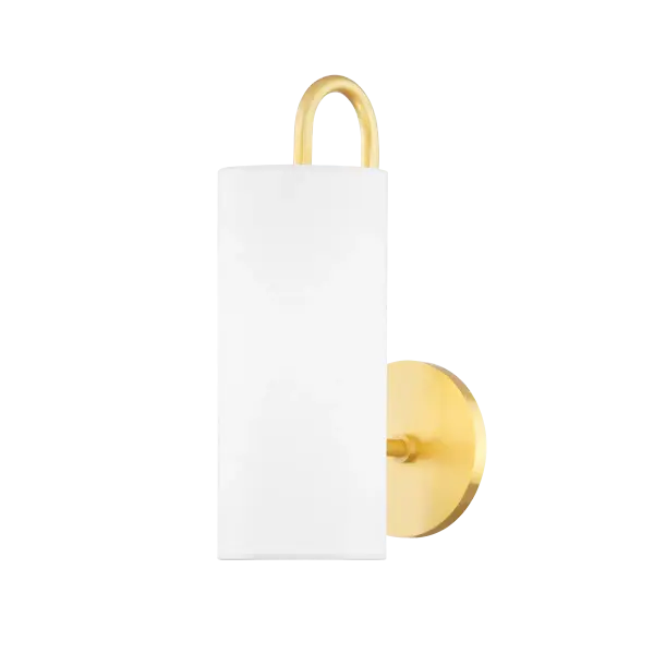 The Freda Wall Sconce combines classic elegance with contemporary simplicity. Its aged gold brass finish and glass globe shade create warm, inviting illumination perfect for intimate spaces and hallways.
