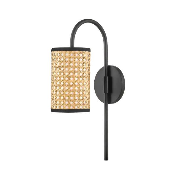 The Dolores Wall Sconce brings theatrical bohemian flair with intricately woven natural cane around a white cotton shade. Its soft black finish and artisanal craftsmanship make it perfect for adding organic texture and vintage-inspired charm.
