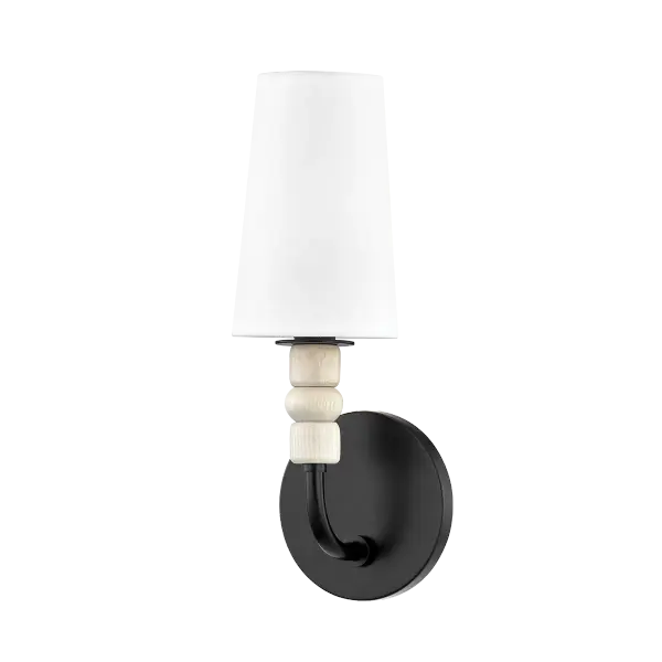The Casey Wall Sconce blends playful geometric wood baubles with refined aged brass and Belgian linen. Its modern totem-inspired design adds warmth and character to any space while maintaining sophisticated polish.