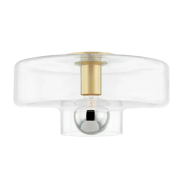 The Iona Flush Mount reimagines the traditional mushroom fixture with contemporary flair. Its clear glass drum shade beautifully showcases the globe bulb while the aged brass finish adds warmth and sophistication to any space.