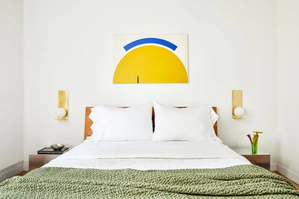 The Lani Wall Sconce transforms functional lighting into art with its distinctive floating opal globe and architectural backplate. Creates beautiful ambient glow through direct and indirect light distribution. - alternate view