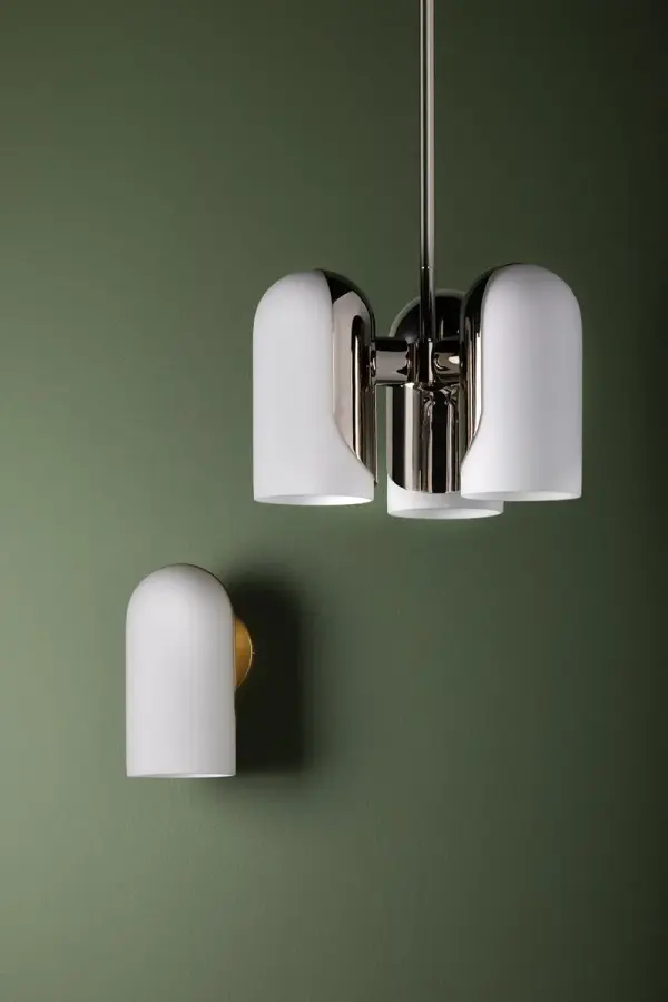 Mabel combines timeless elegance with modern simplicity. The opal glass shade provides soft, flattering illumination while the polished metal plate adds a refined touch perfect for bathroom vanities and bedroom spaces. - alternate view