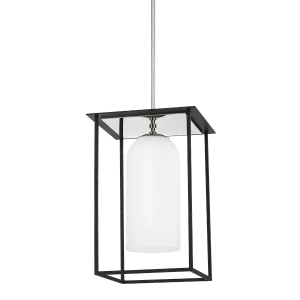 The Teres Pendant reimagines traditional lantern lighting with a contemporary twist. Its floating opal cylinder within a textured black cage creates dramatic visual interest while providing excellent ambient illumination.