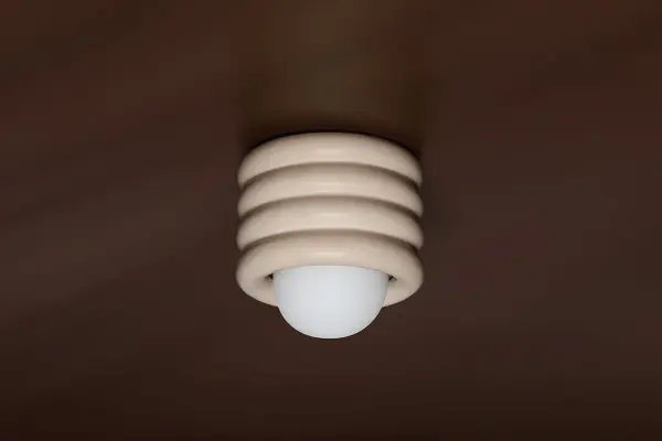 The Bibi Flush Mount brings a soothing, contemporary aesthetic with its stacked ceramic pillows in antique ivory. Inspired by upholstered furniture design, it offers versatile styling that works beautifully in intimate spaces. - alternate view