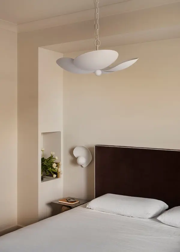 The Leni Pendant brings nature-inspired design indoors with its distinctive petal-shaped shades. Five lights create beautiful ambient and task lighting, while the textured white finish adds visual interest and complements diverse interiors. - alternate view