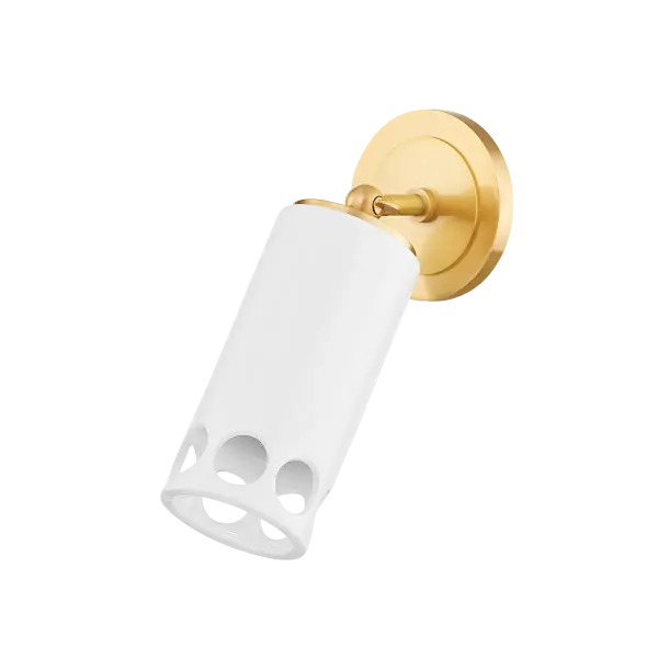 The Jean Wall Sconce combines classic aged brass finish with clear glass for a sophisticated lighting solution. Its compact design and transitional style make it versatile for various interior settings.