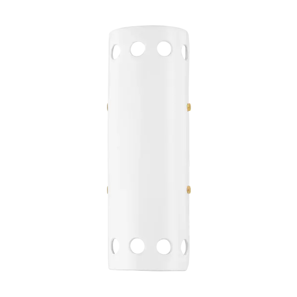 The Jean Wall Sconce combines classic aged brass finish with clear glass for a sophisticated lighting solution. Its compact design and transitional style make it versatile for various interior settings.