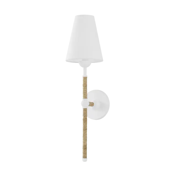 The Mariana Wall Sconce features handcrafted textured glass that creates unique light patterns and visual interest. Each piece is one-of-a-kind with natural variations in color and pattern, making it perfect for adding artisanal character to contemporary spaces.