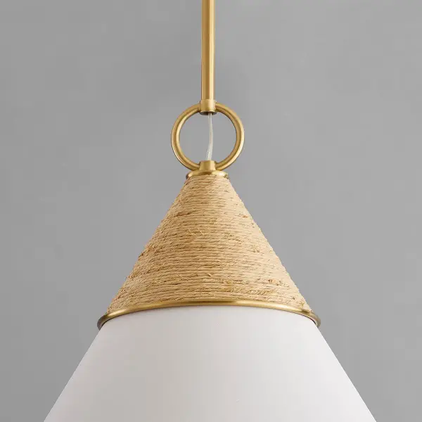 The Mica Pendant beautifully balances coastal sophistication with approachable organic texture. Wrapped raffia detailing adds warmth to the sleek aged gold brass silhouette, creating gentle ambient light perfect for intimate spaces. - alternate view